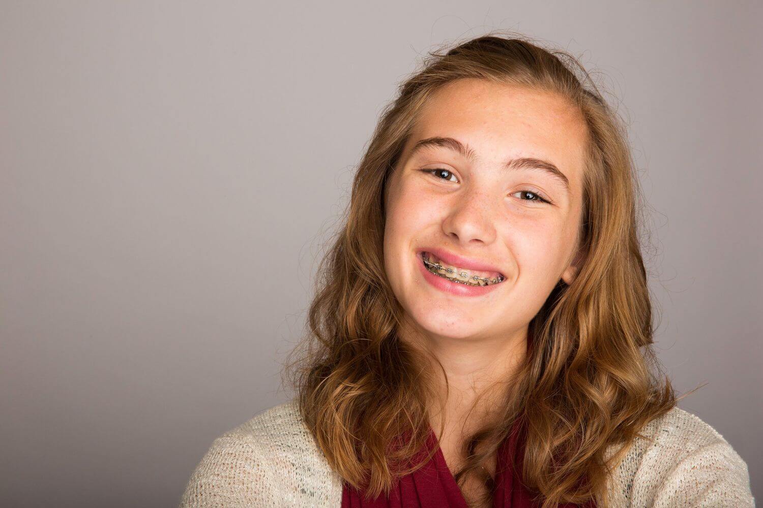 Smiling teenage girl wearing braces